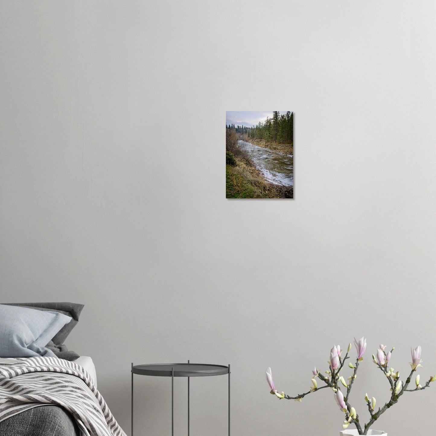 Kelowna BC landscape poster displayed in a modern living room with neutral decor and a floral arrangement.