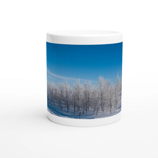 Snowy trees sunrise ceramic mug with winter landscape design