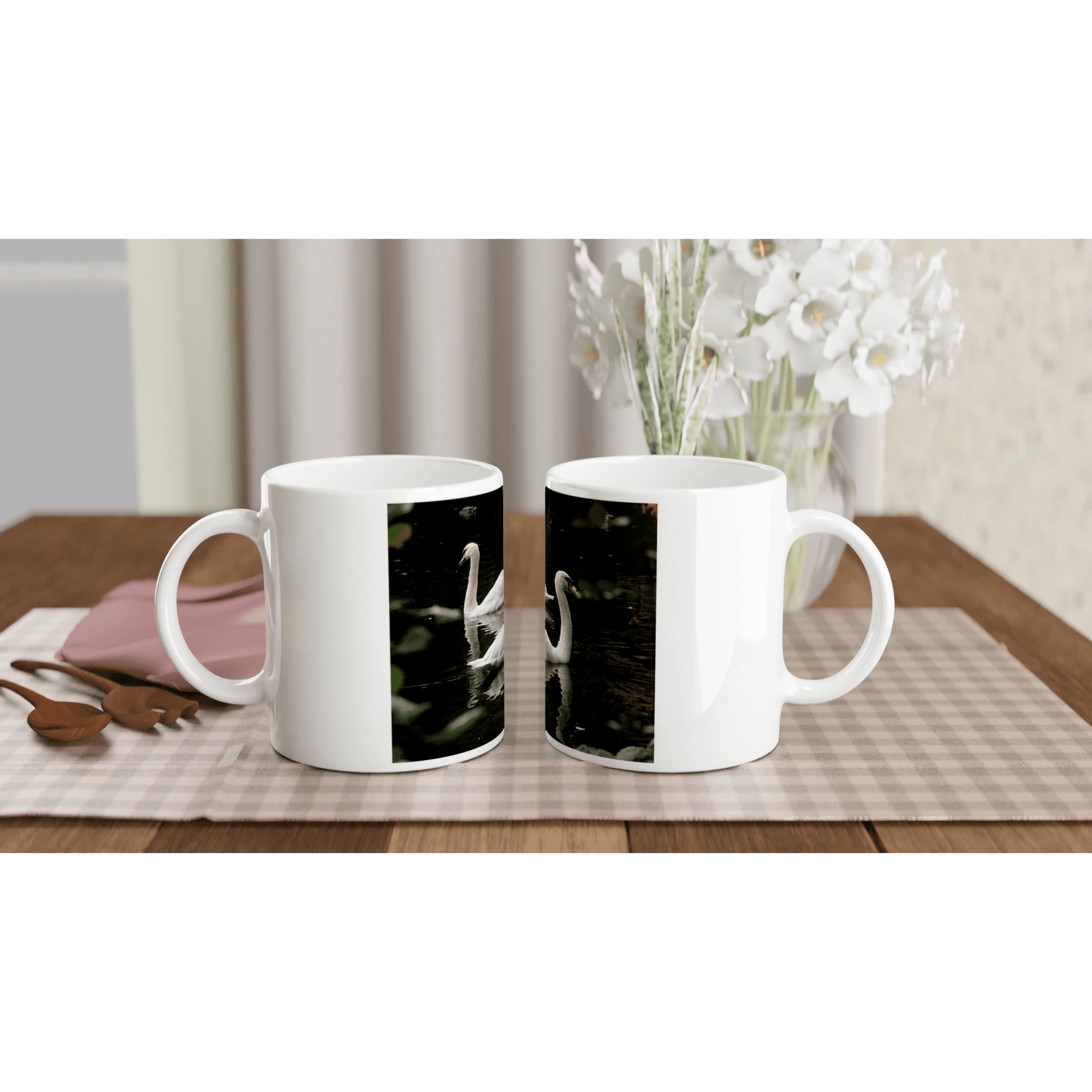 Two swans ceramic mug featuring a graceful swan design on a glossy white 11oz cup.